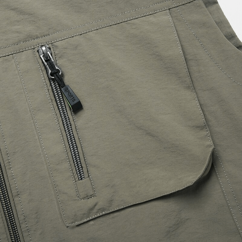 Close-up of men's casual stand collar vest with zipper pocket detail, highlighting durable polyester fabric in solid color.